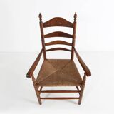 Antique wooden armchair with cane seat, France ca. 1900