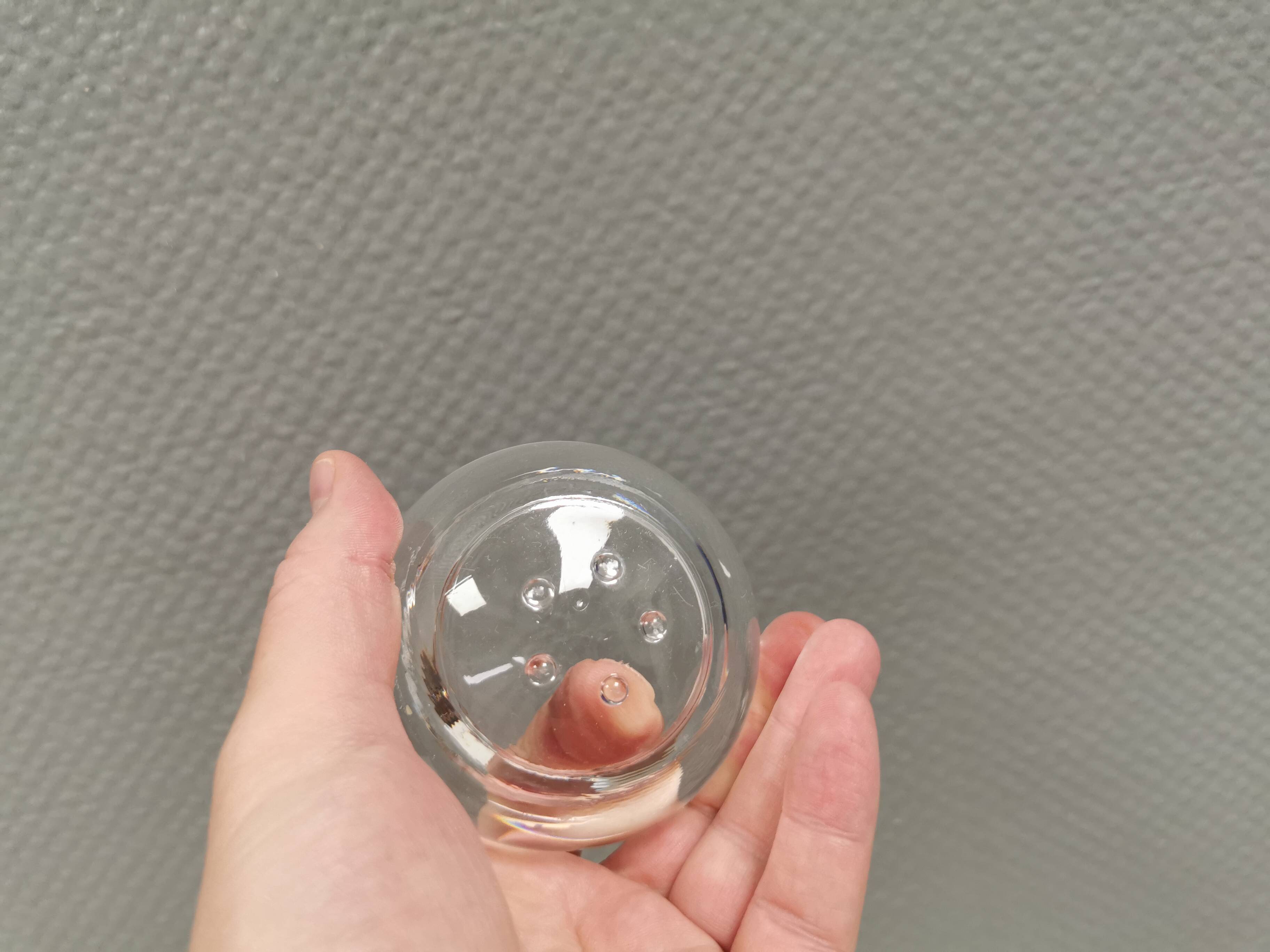 A set of iittala candle holders in clear transparent glass.