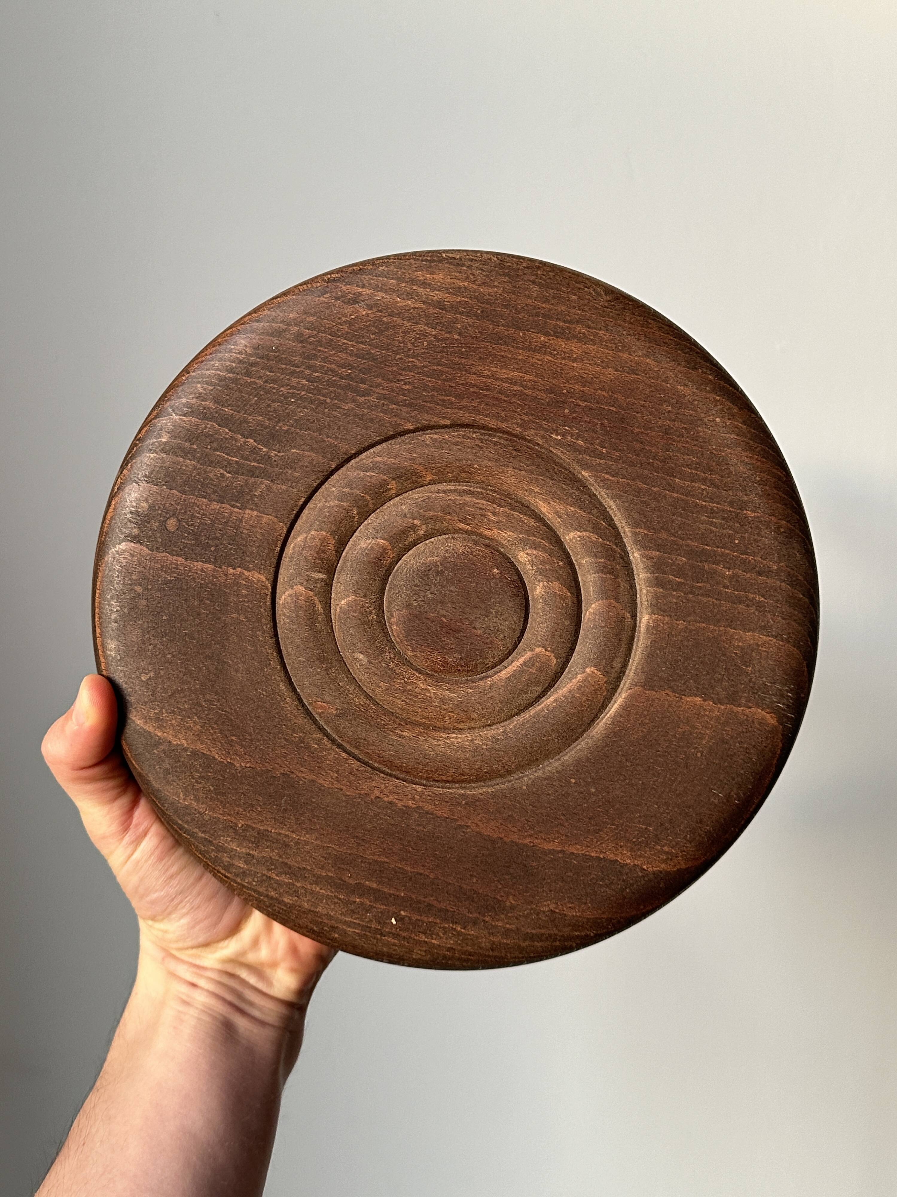 Wooden stool with three twisted legs
