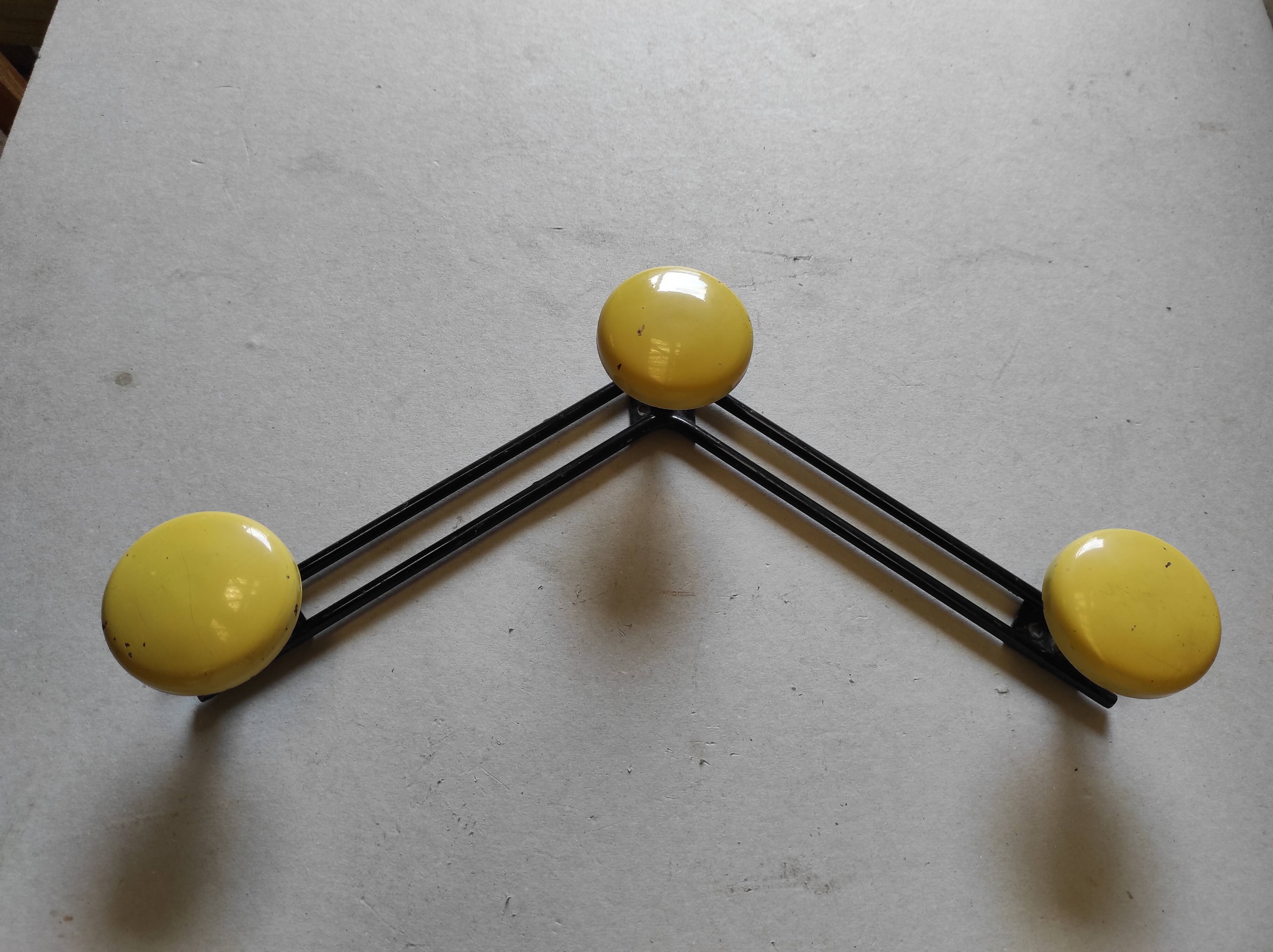 Vintage wall mount in black and yellow metal