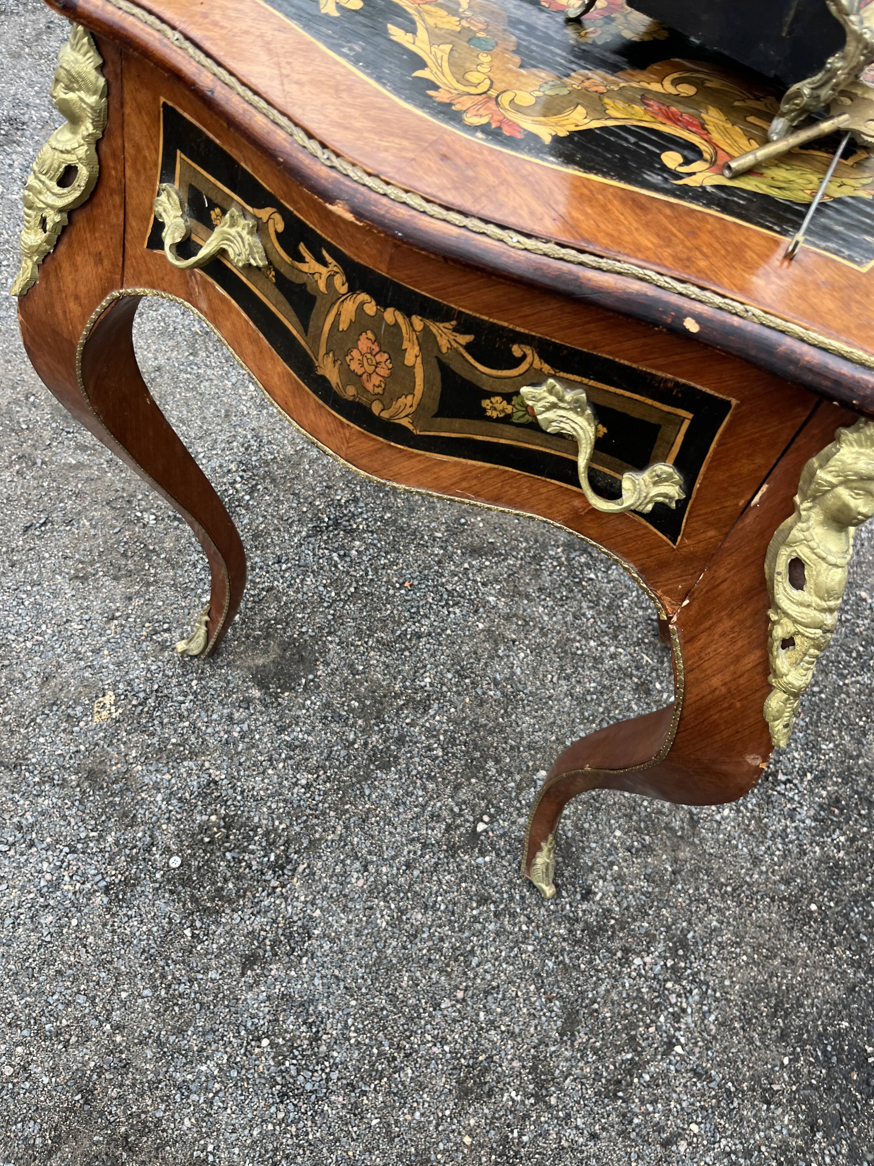 Louis XV style side table with marquetry and gilded bronze.