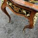 Louis XV style side table with marquetry and gilded bronze.