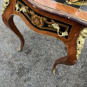 Louis XV style side table with marquetry and gilded bronze.