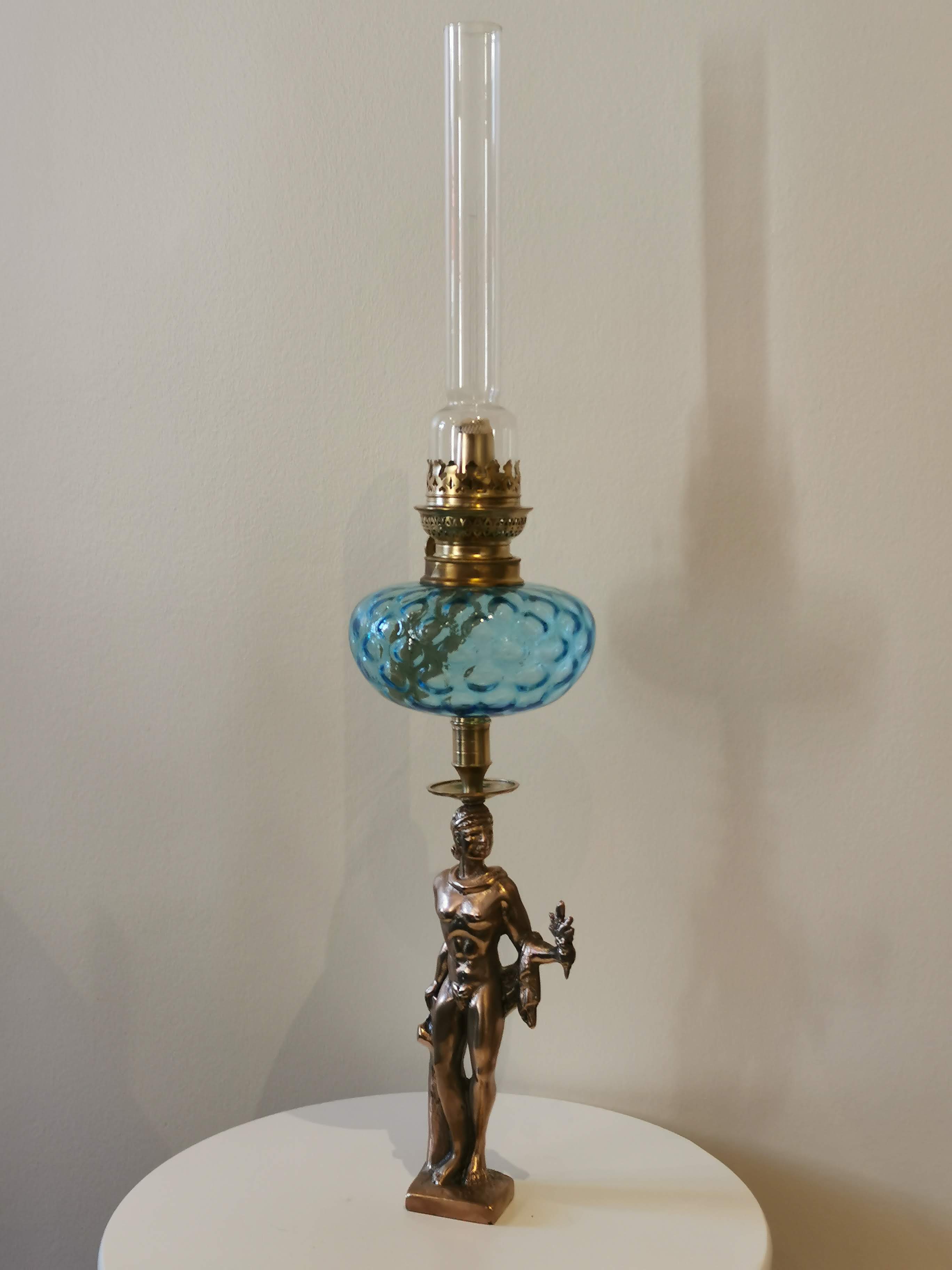 Large kerosene lamp mounted on bronze statue. Late nineteenth century