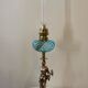 Large kerosene lamp mounted on bronze statue. Late nineteenth century