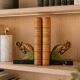 Art Deco pair of bookends with ram's heads, patinated metal and black marble.