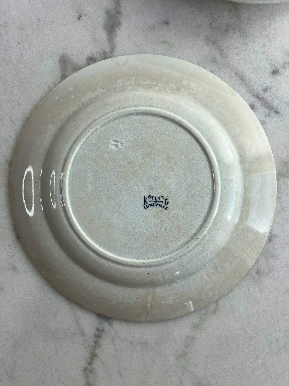 Set of five Lunéville KG Delet dessert plates.