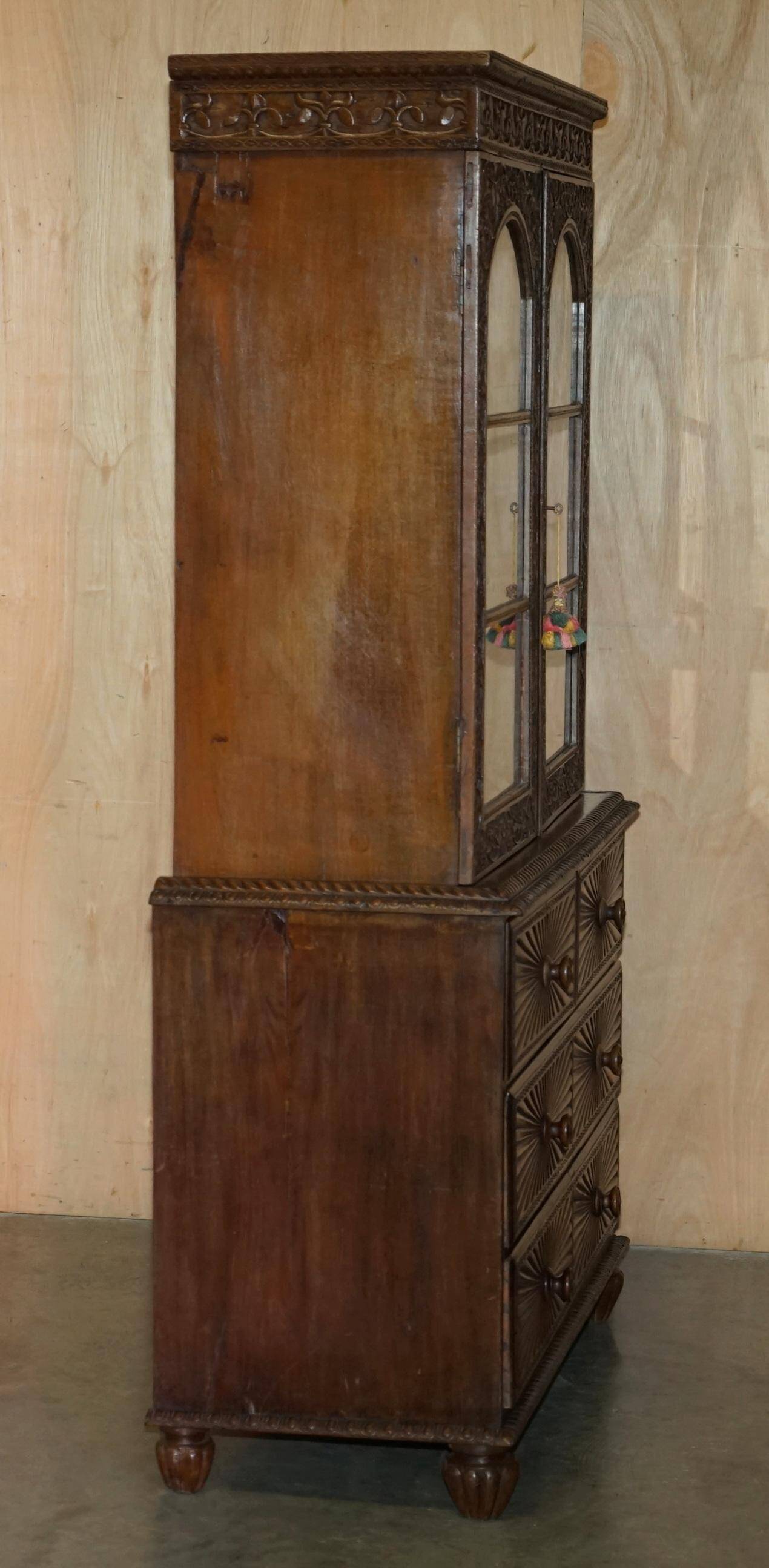 19th-century Anglo-Indian colonial hardwood library on a chest of drawers.