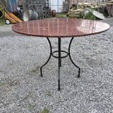 Round marble table with wrought iron base from the mid-20th century.