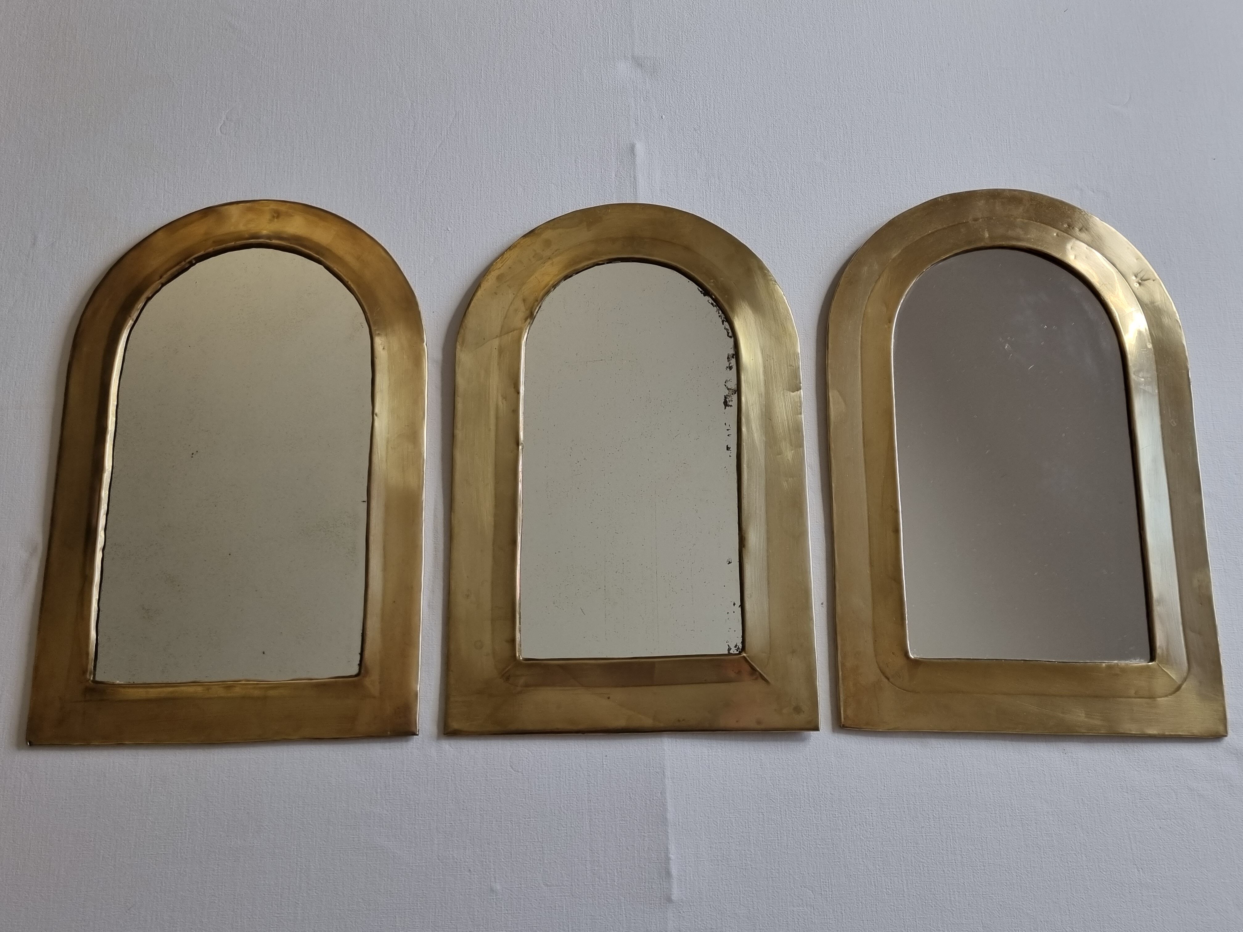 Set of three Moroccan brass mirrors in the form of arches, 43 cm