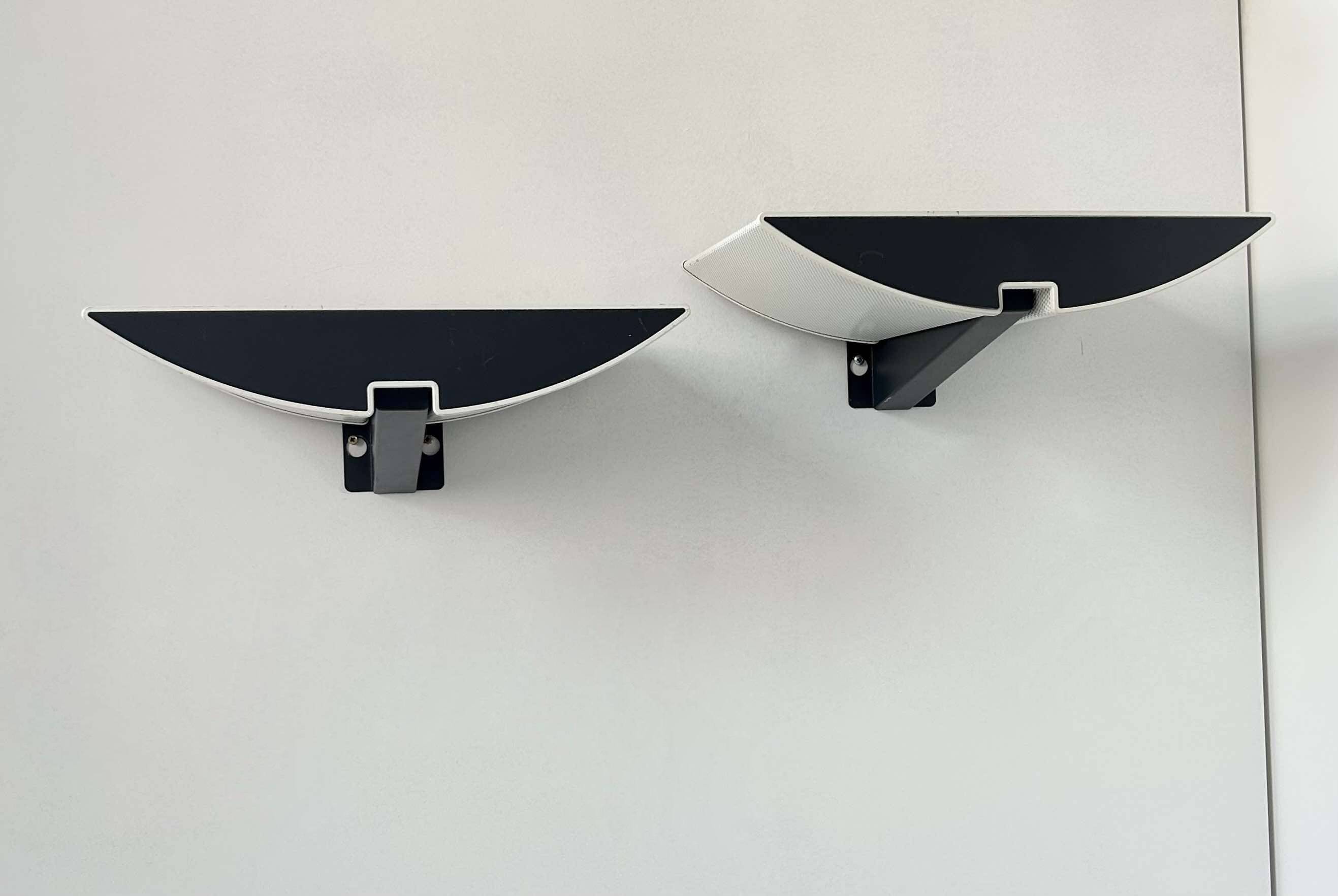 Pair of modernist wall lights, black and white lacquered metal, Italy 1980
