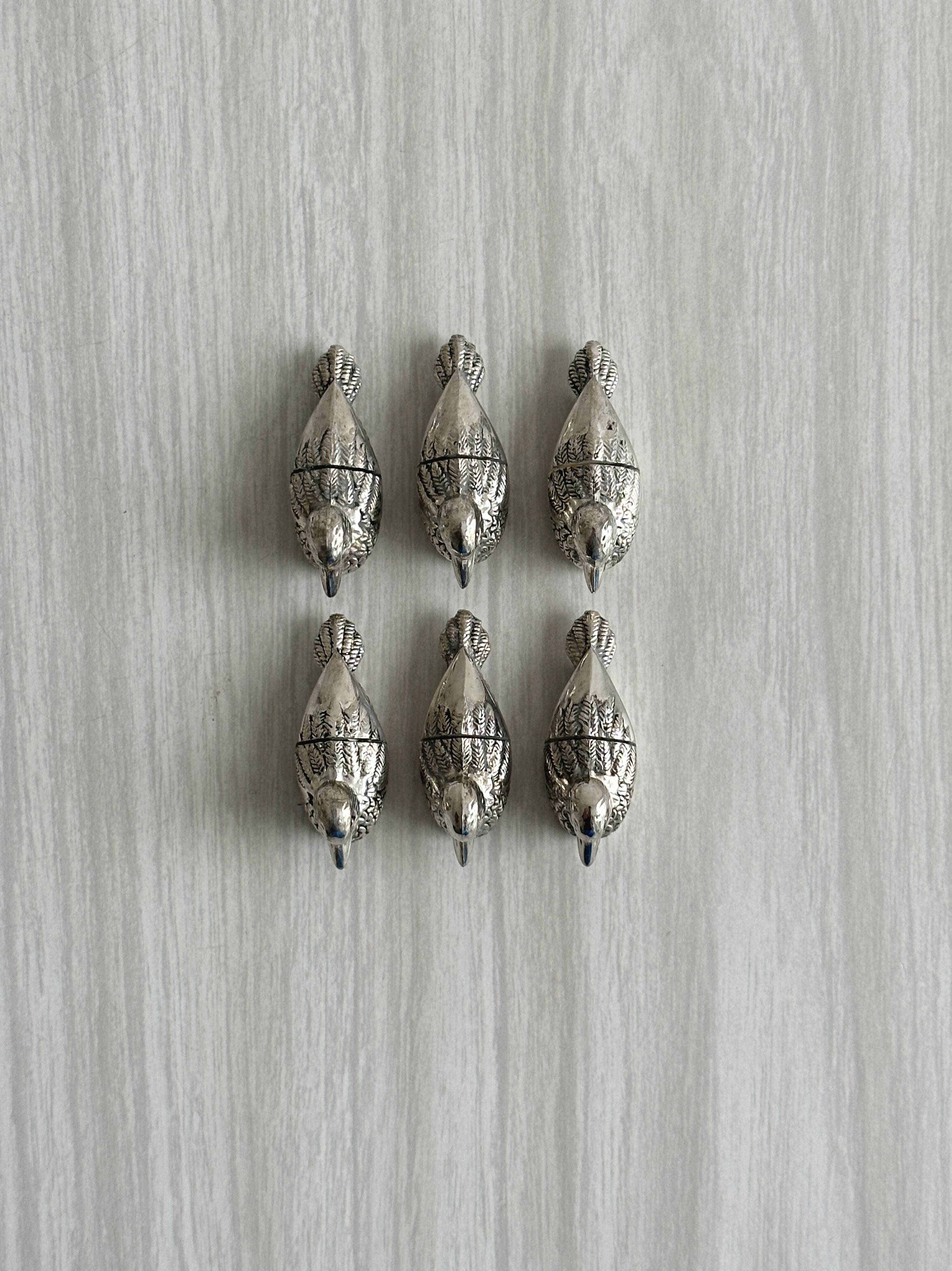 Set of 6 silver-plated metal ducks, name holders and knife rests.