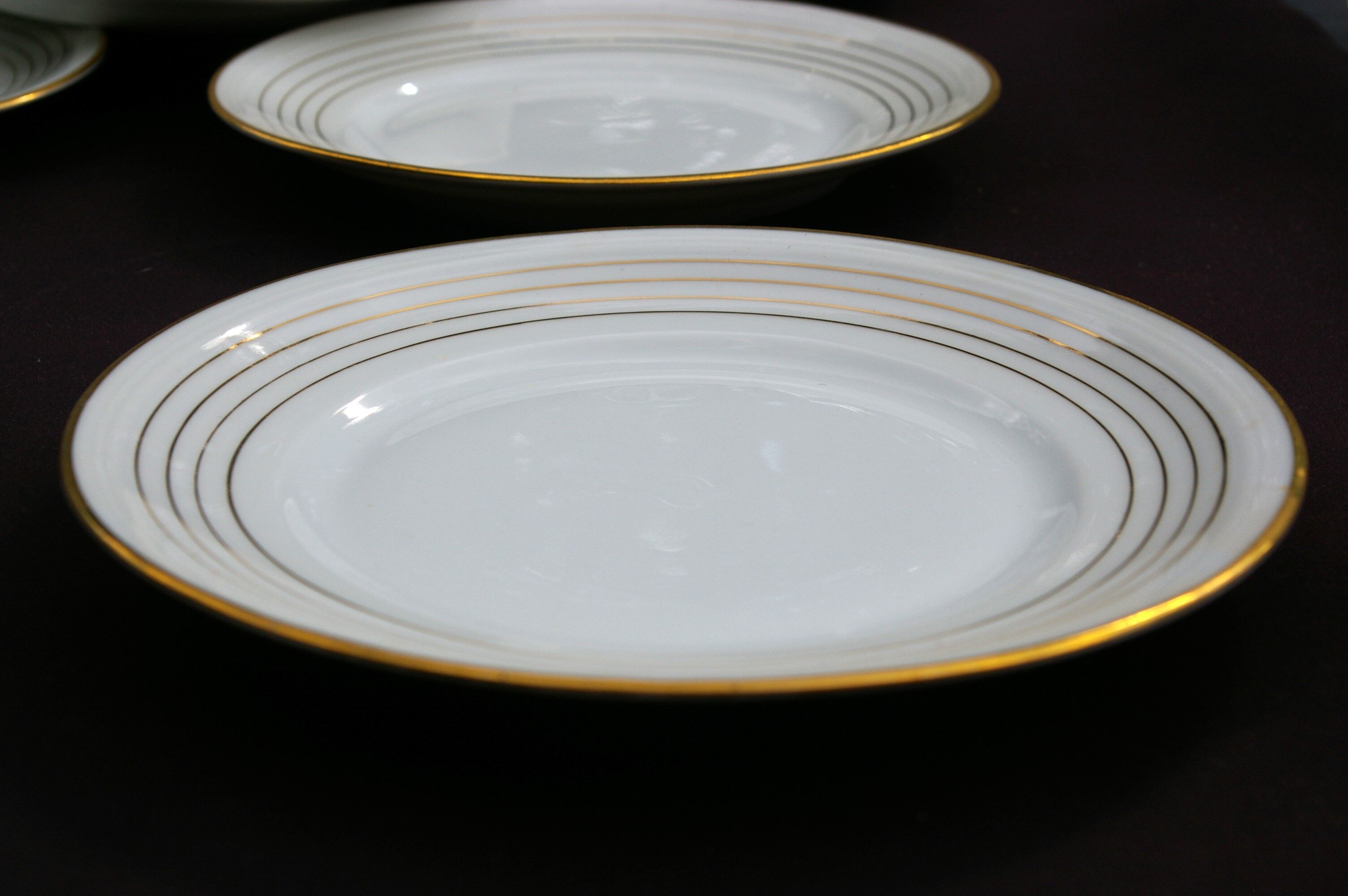 11 Dessert Plates in White Porcelain and Art Deco Gold