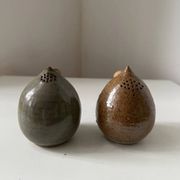 Pair of vintage round stoneware salt and pepper shakers