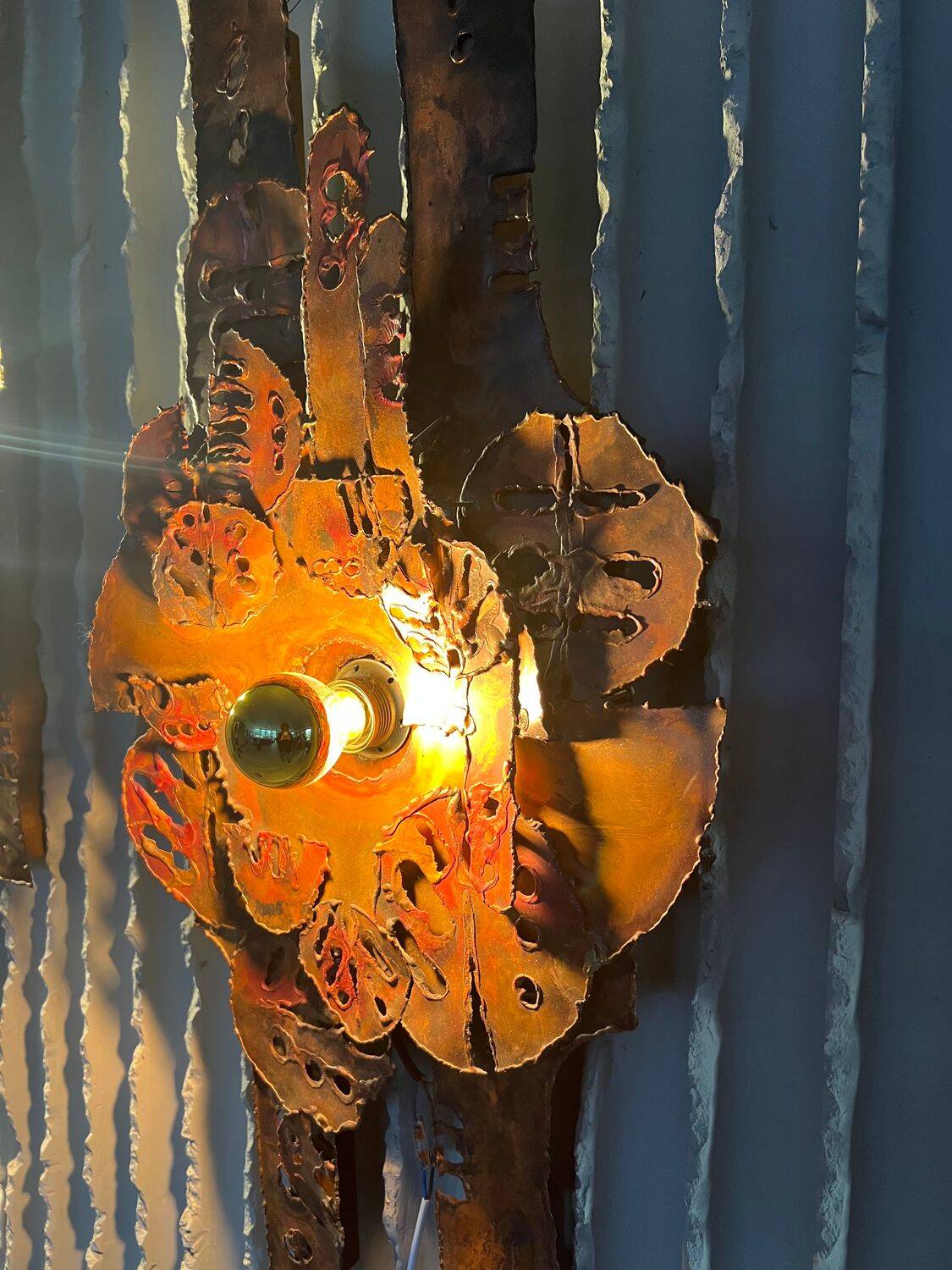 Set of raw expressive wall sconces by Francesco Pasinato