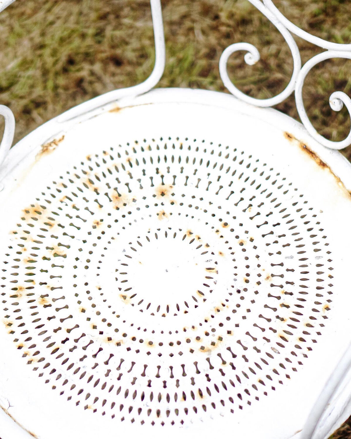 Duo of wrought iron armchairs