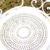 Duo of wrought iron armchairs