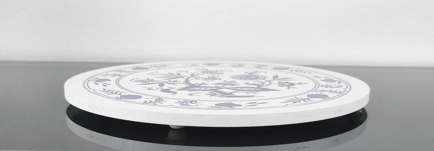 Vintage round trivet with blue floral pattern - 1970s