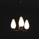 Brass chandelier and tulips in vintage white glass