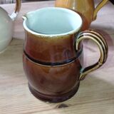 Set of three glazed stoneware pitchers