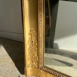 Golden mirror style Restoration decorated with stretched palmettes