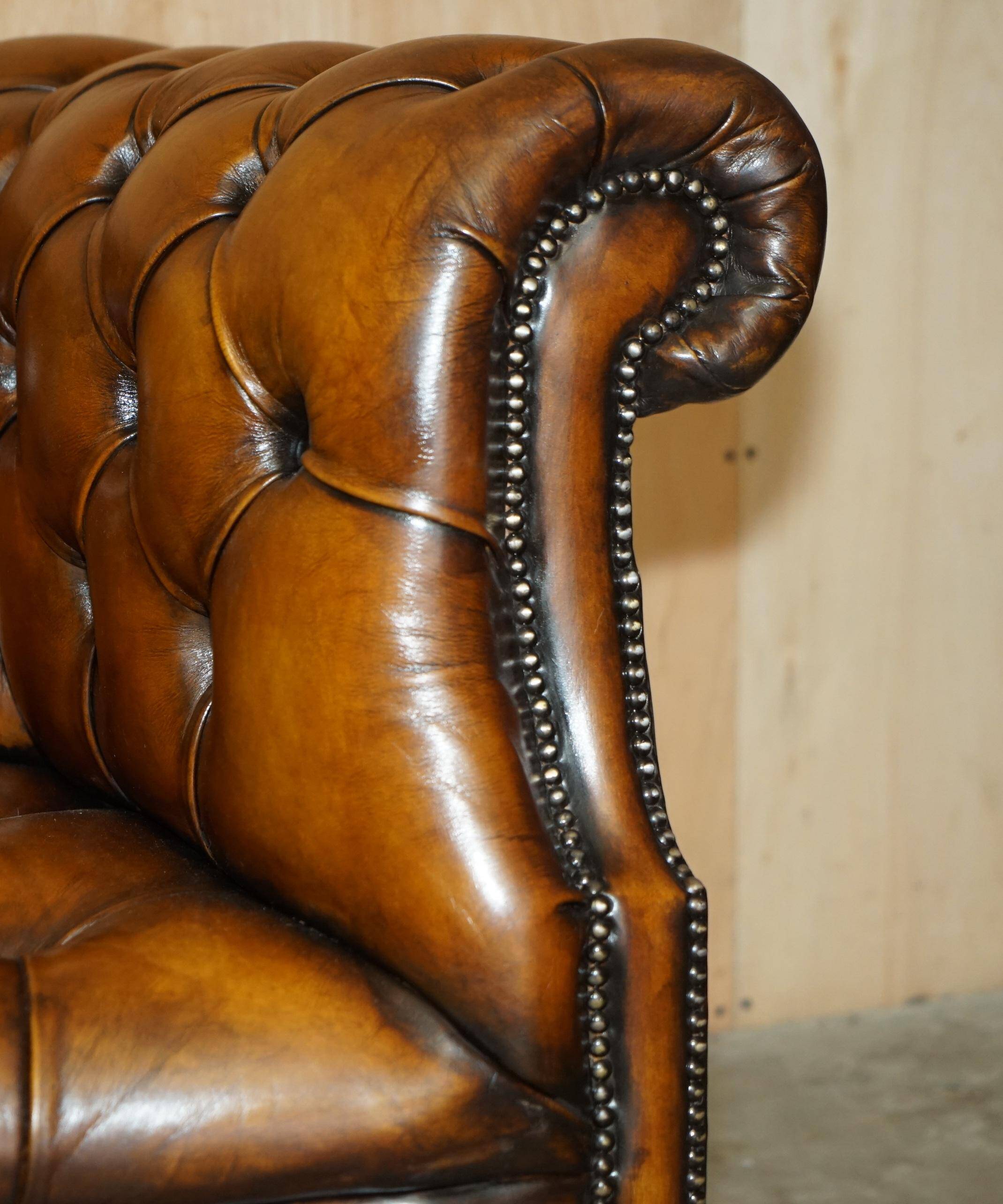 Vintage Chesterfield serpentine luxury sofa in restored leather