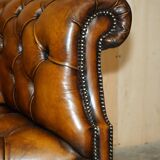 Vintage Chesterfield serpentine luxury sofa in restored leather
