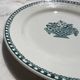 Vintage flat plate in green earthenware Manufacture Saint-Amand 4525 Basket of Flowers