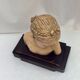 Girl's head in terracotta numbered