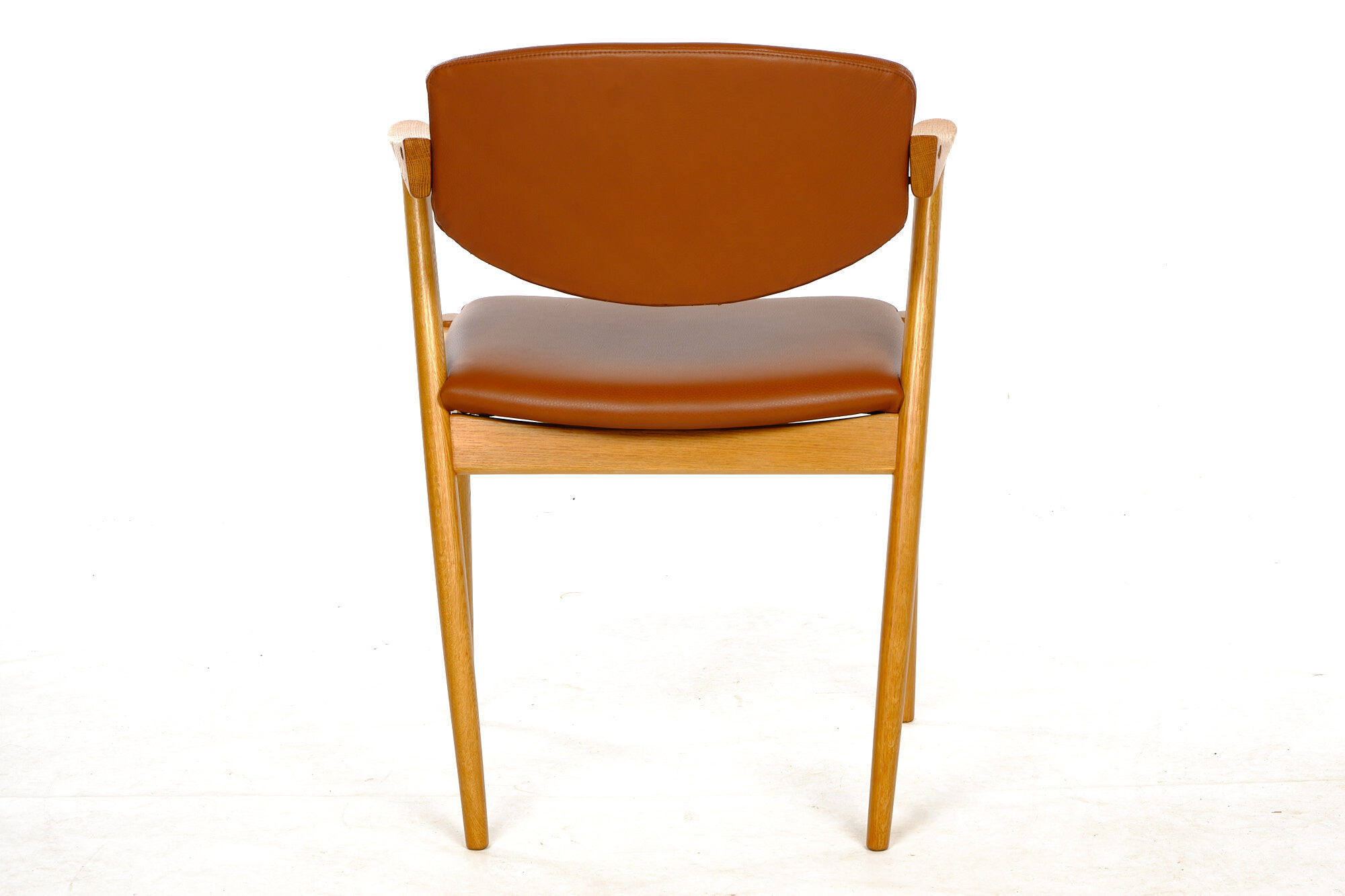 Four Kai Kristiansen oak chairs with new leather upholstery