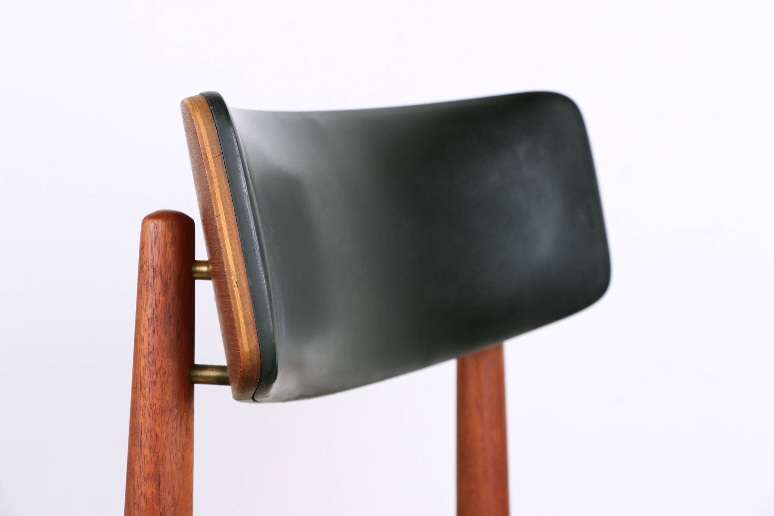 Set of 8 Danish chairs in teak, black leatherette and brass, Sven Chrobat/Sax.