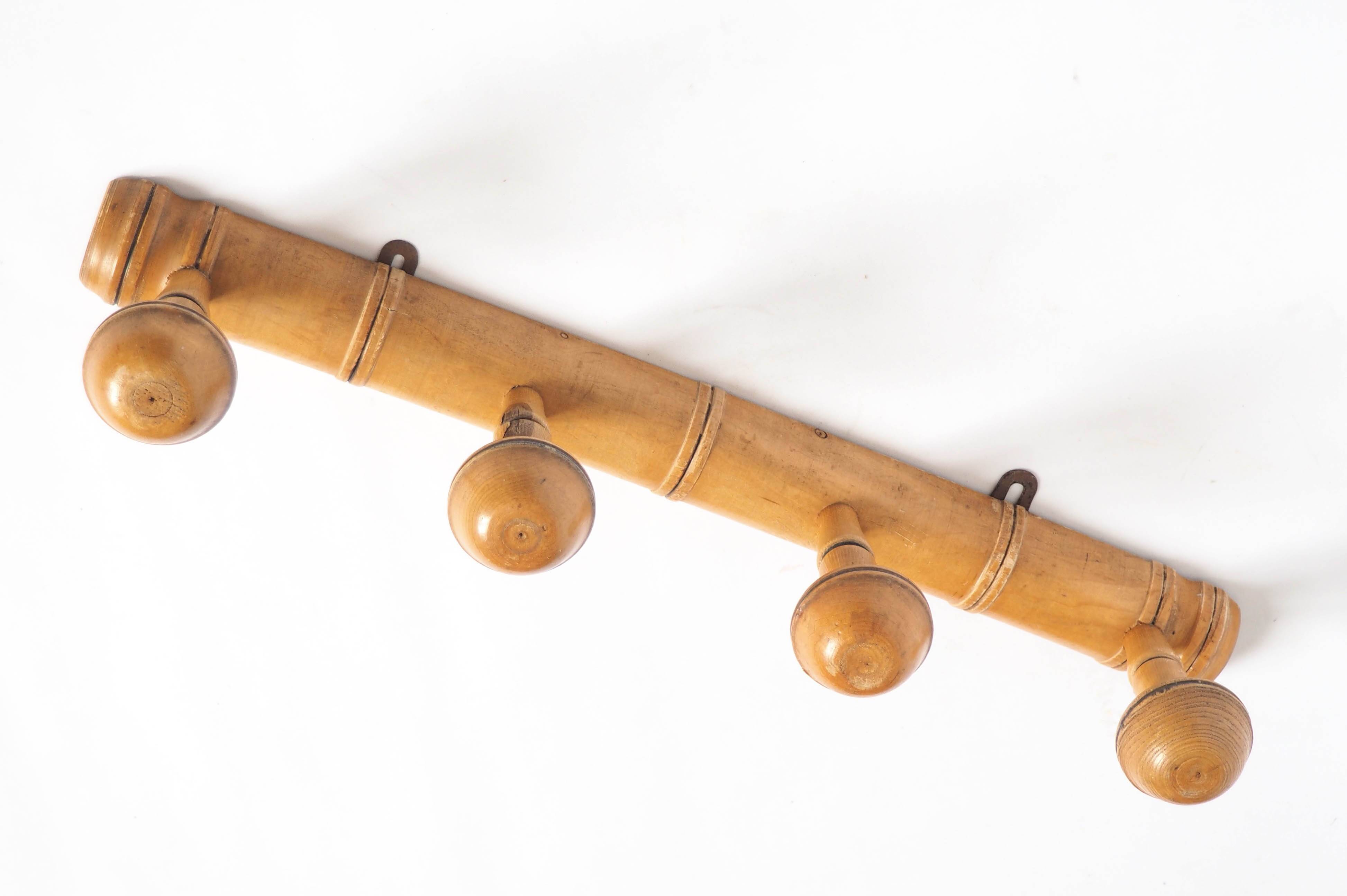 Light wood coat hooks 1900
