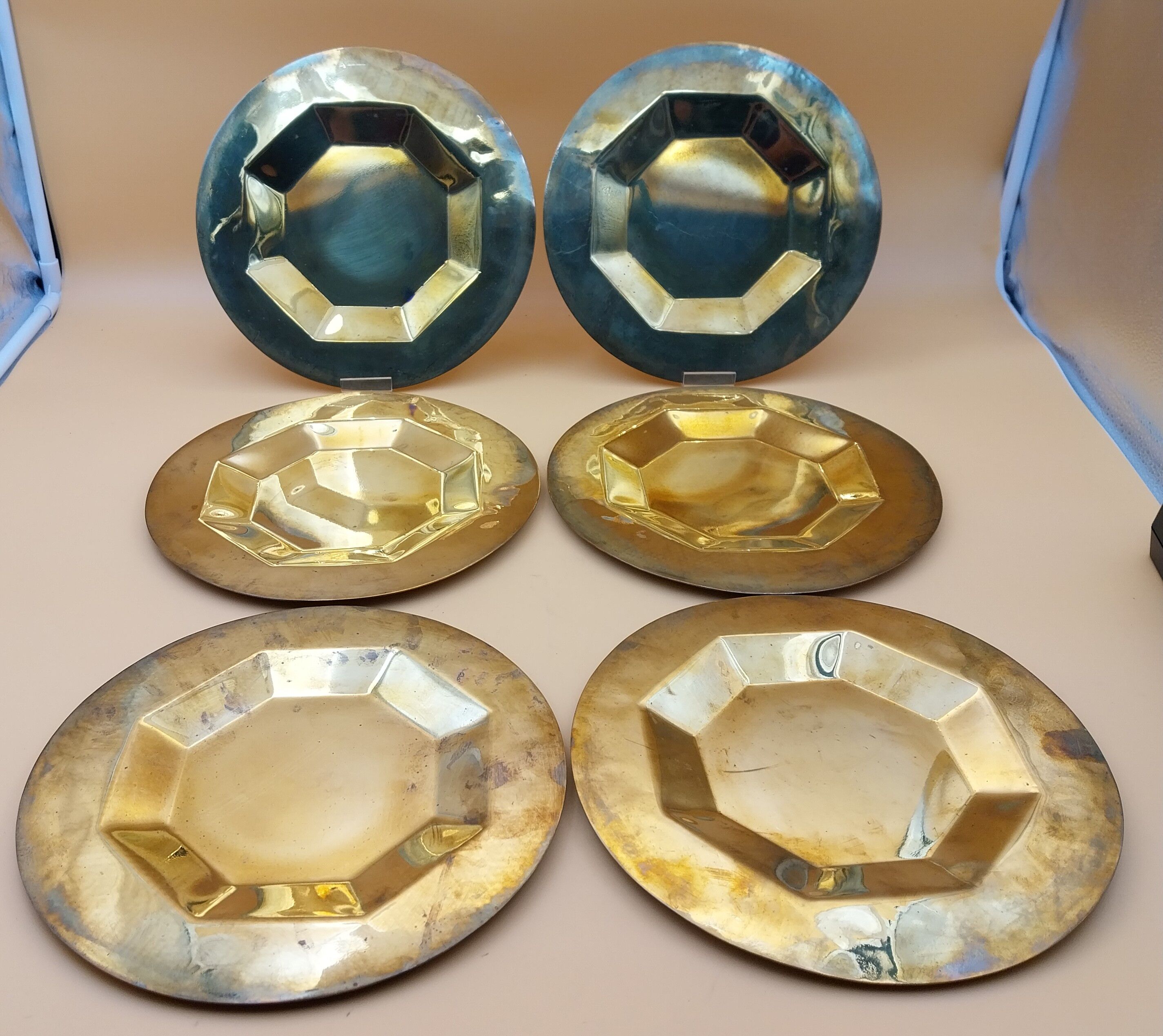 6 brass plates under plates