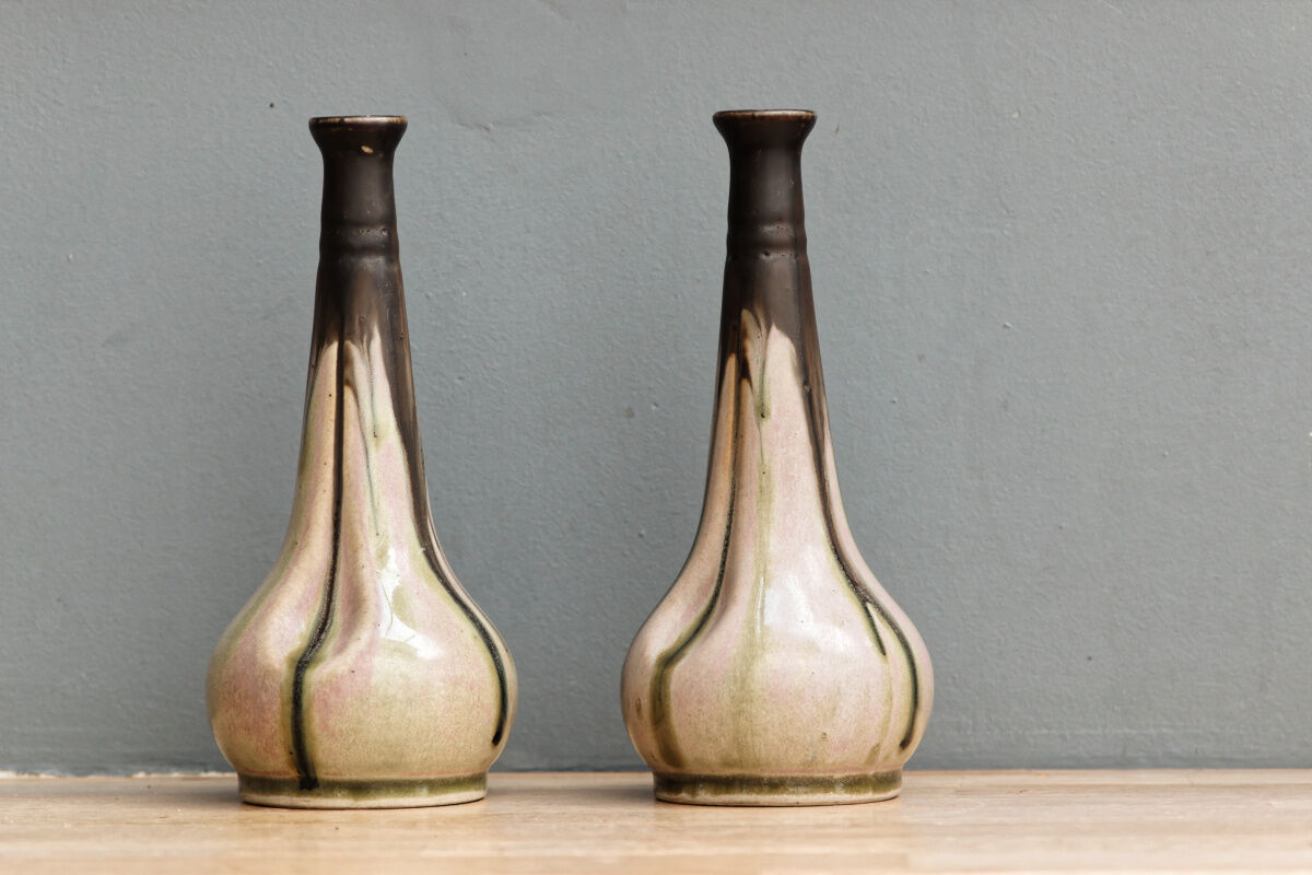 Pair of glazed sizzlings, signed