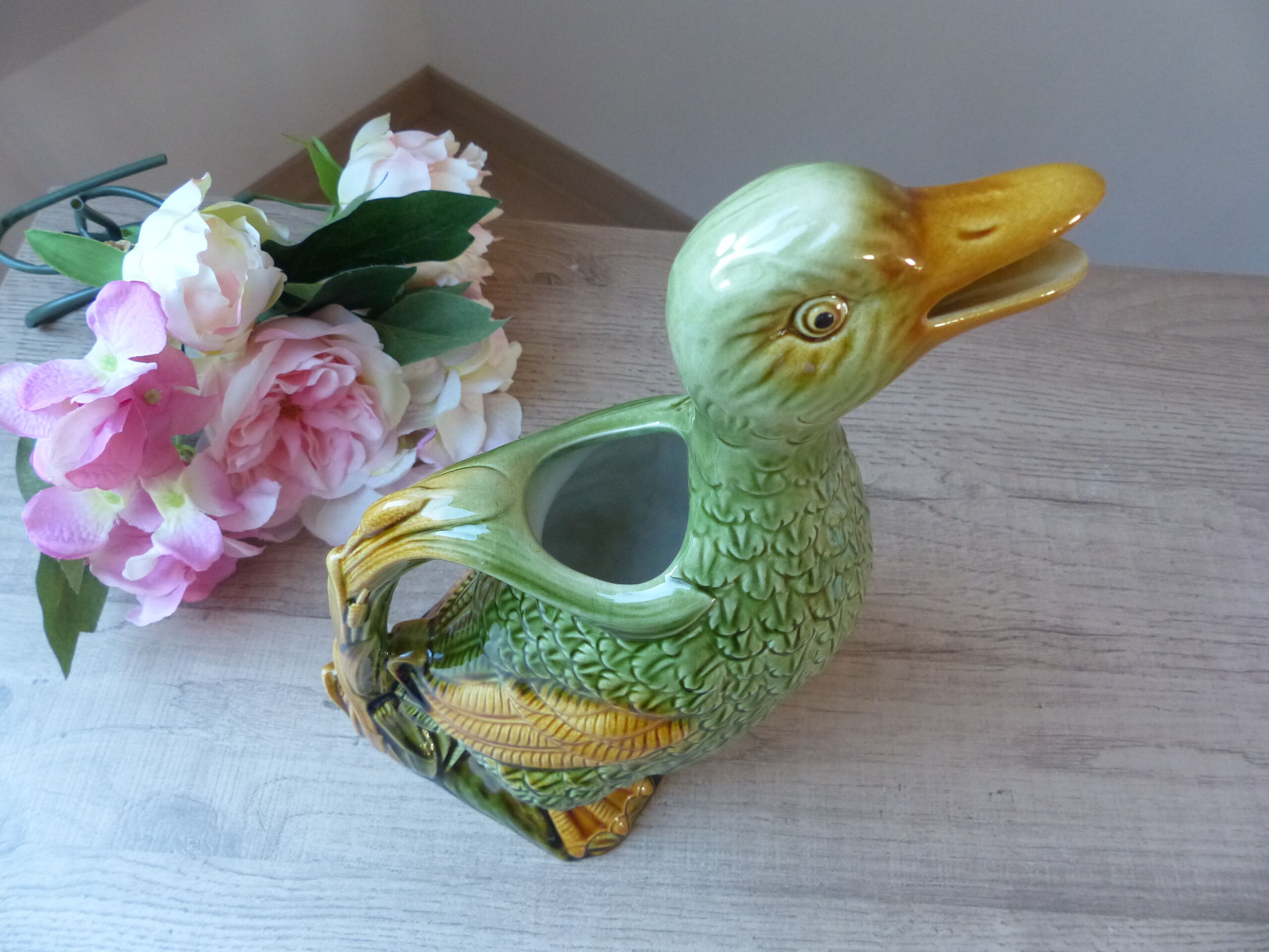 Pitcher zoomorph duck in green and yellow slip
