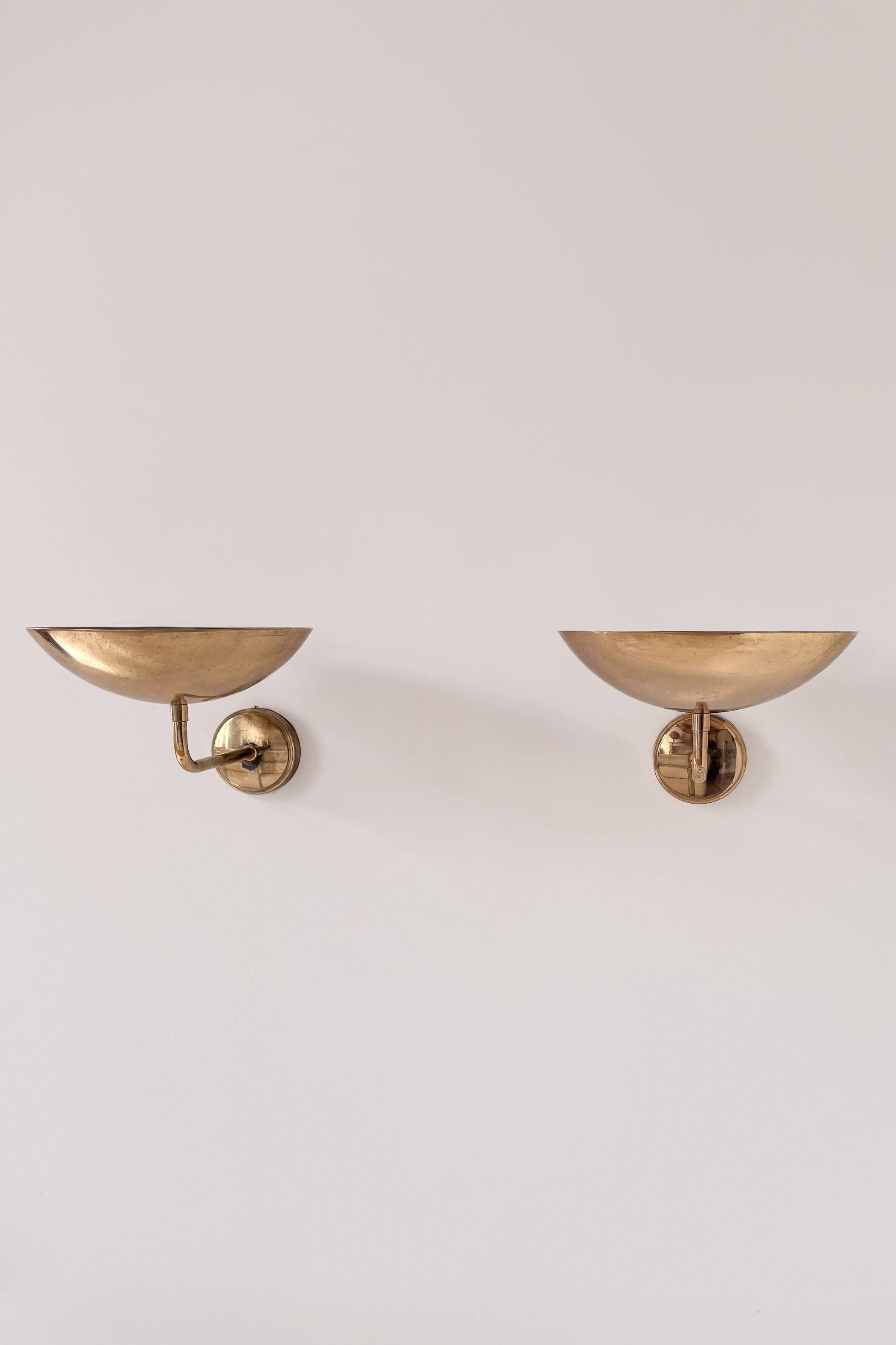 Pair of vintage wall lights, patinated brass, France 1970.