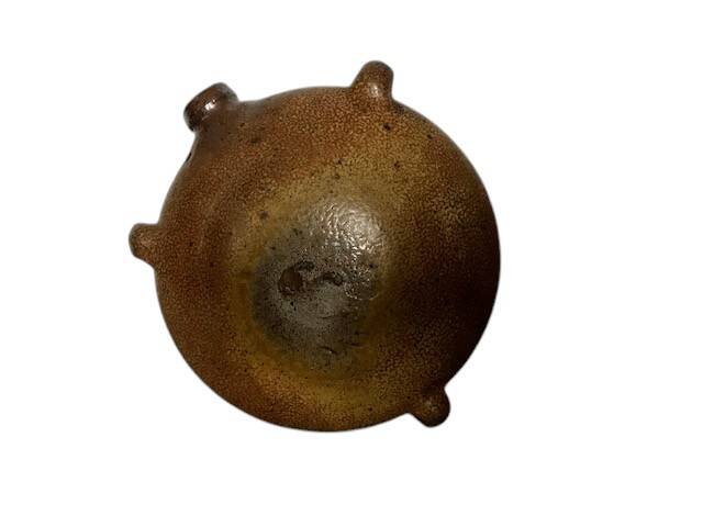 Old stoneware flask known as a toad from the 19th century.