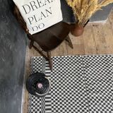 Romanian floral rug handwoven in wool, white and black background