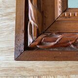 Ancient mirror in carved wood and mercury  48x63cm