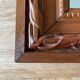 Antique mirror in carved wood and mercury 48x63cm
