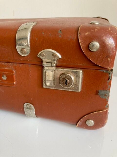 Small old brown suitcase