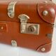 Small old brown suitcase