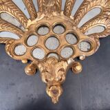 Palm-shaped faceted mirror