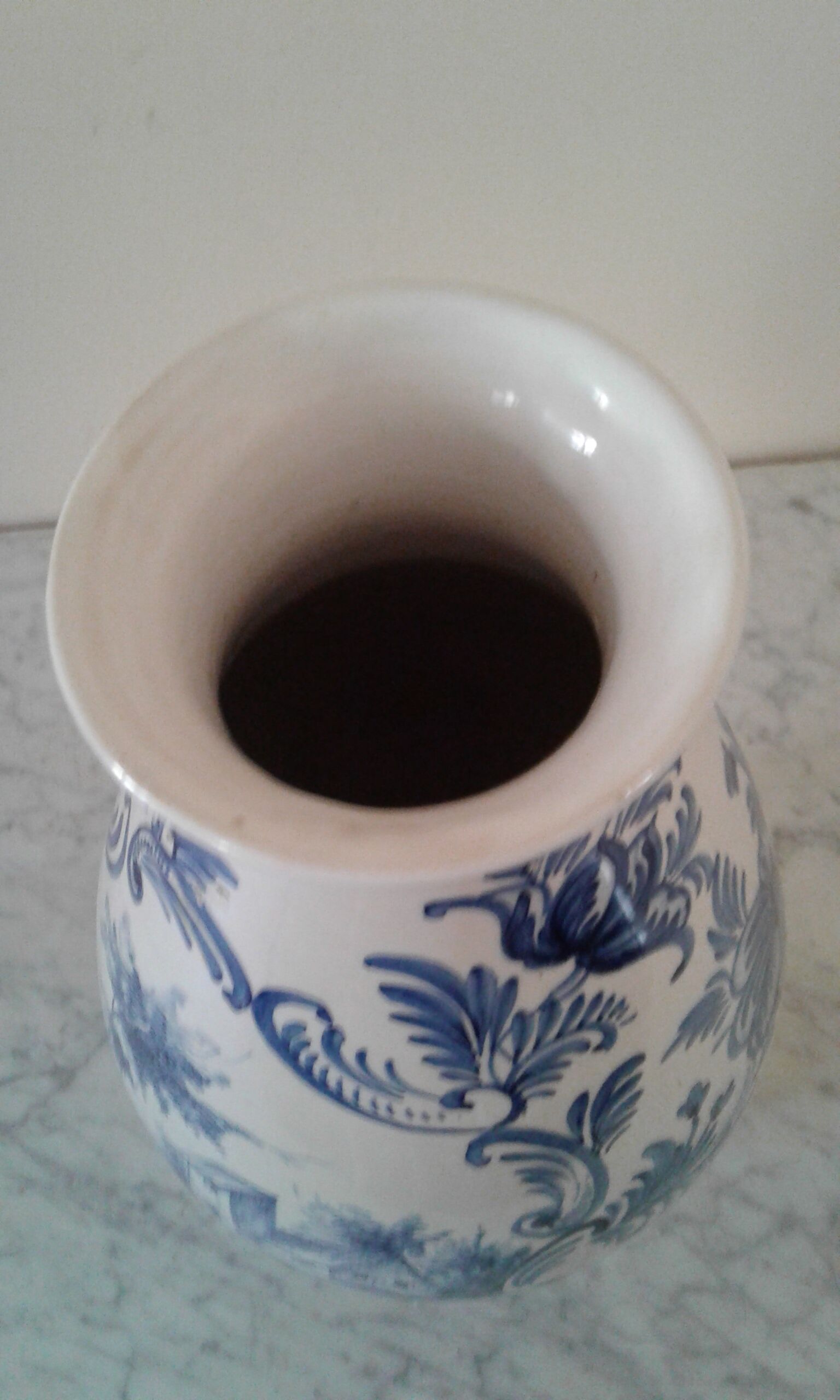 Blue vase adorned with blue and white