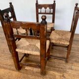 Series of 4 brutalist rustic chairs in carved wood straw seat