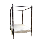 Four-poster bed in late 19th century mahogany