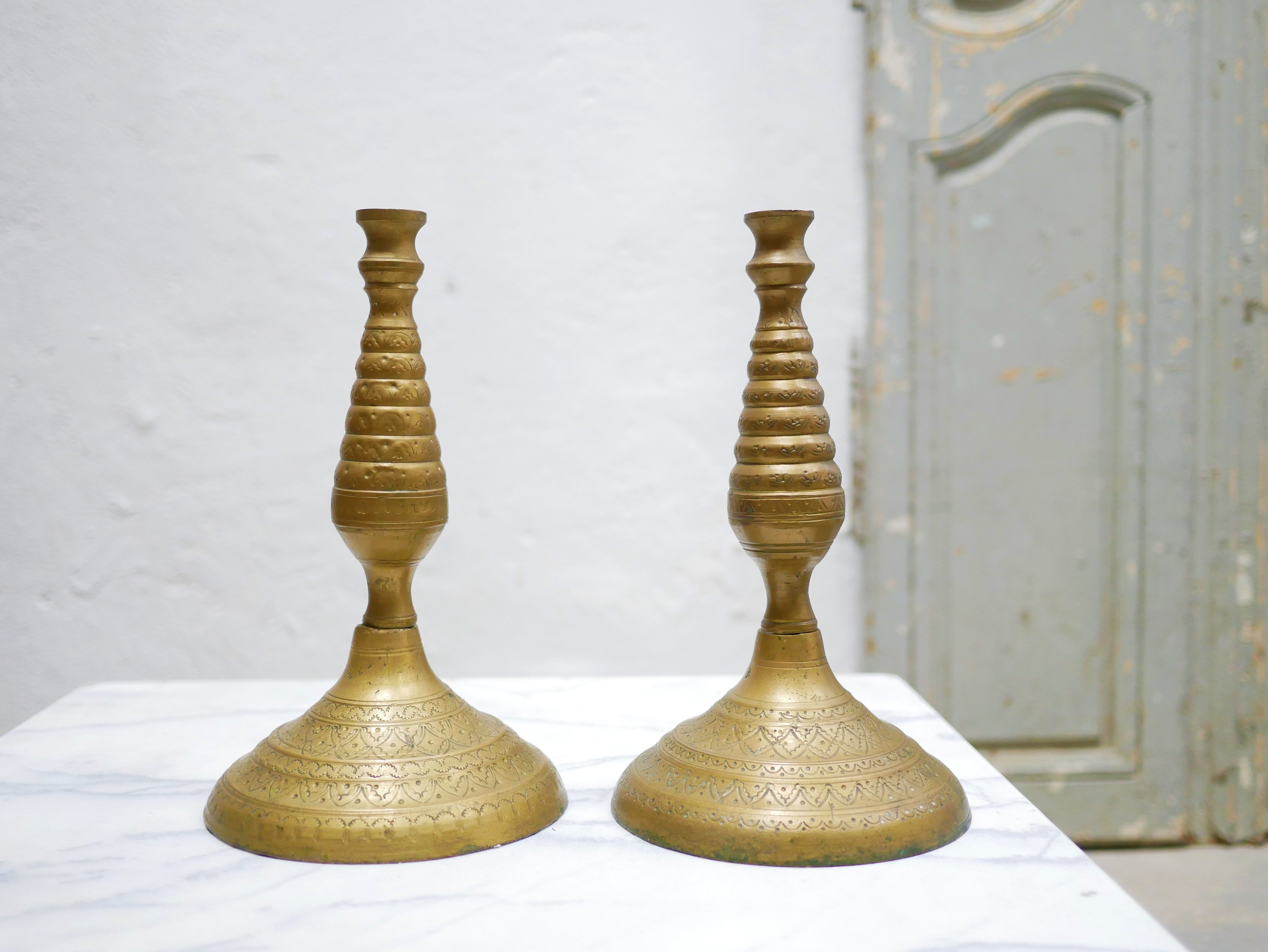 Pair of vintage candle holders in golden brass
