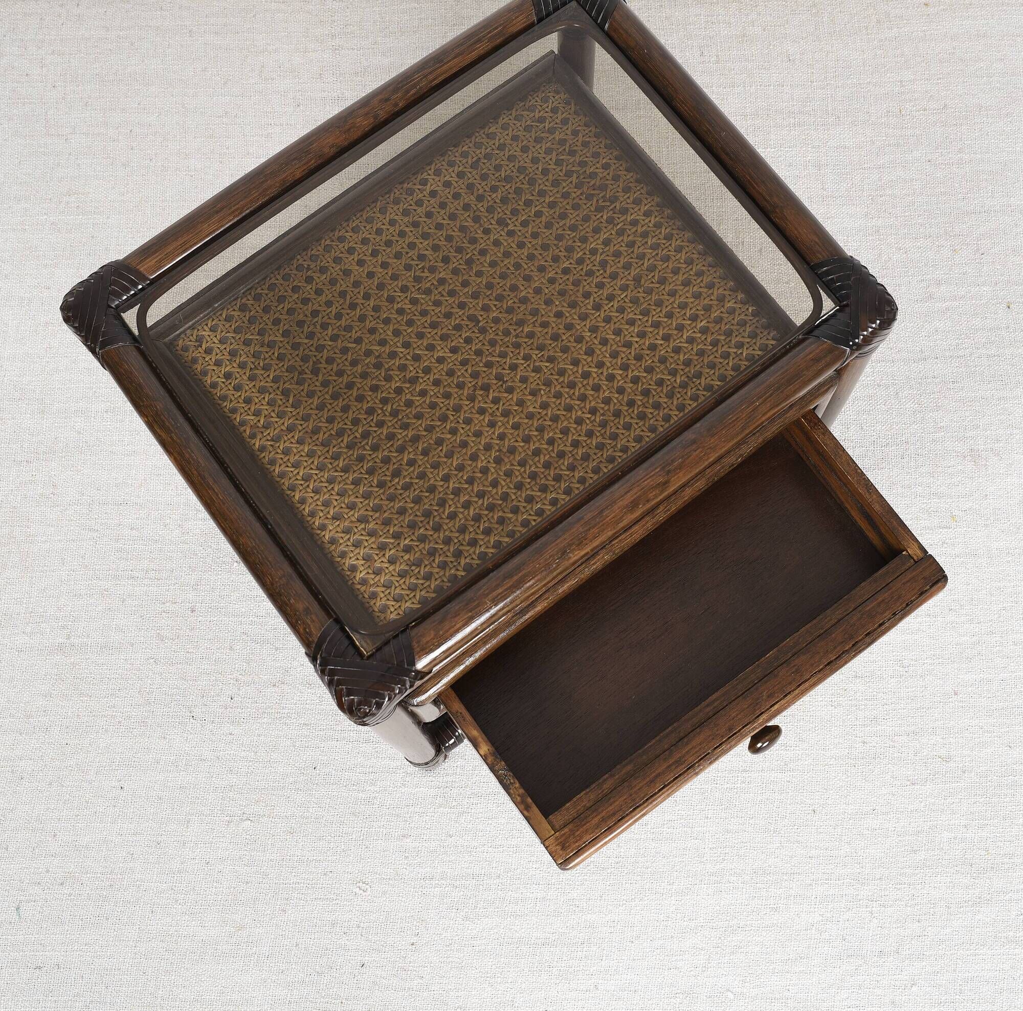 Rattan and cane bedside table, smoked glass top
