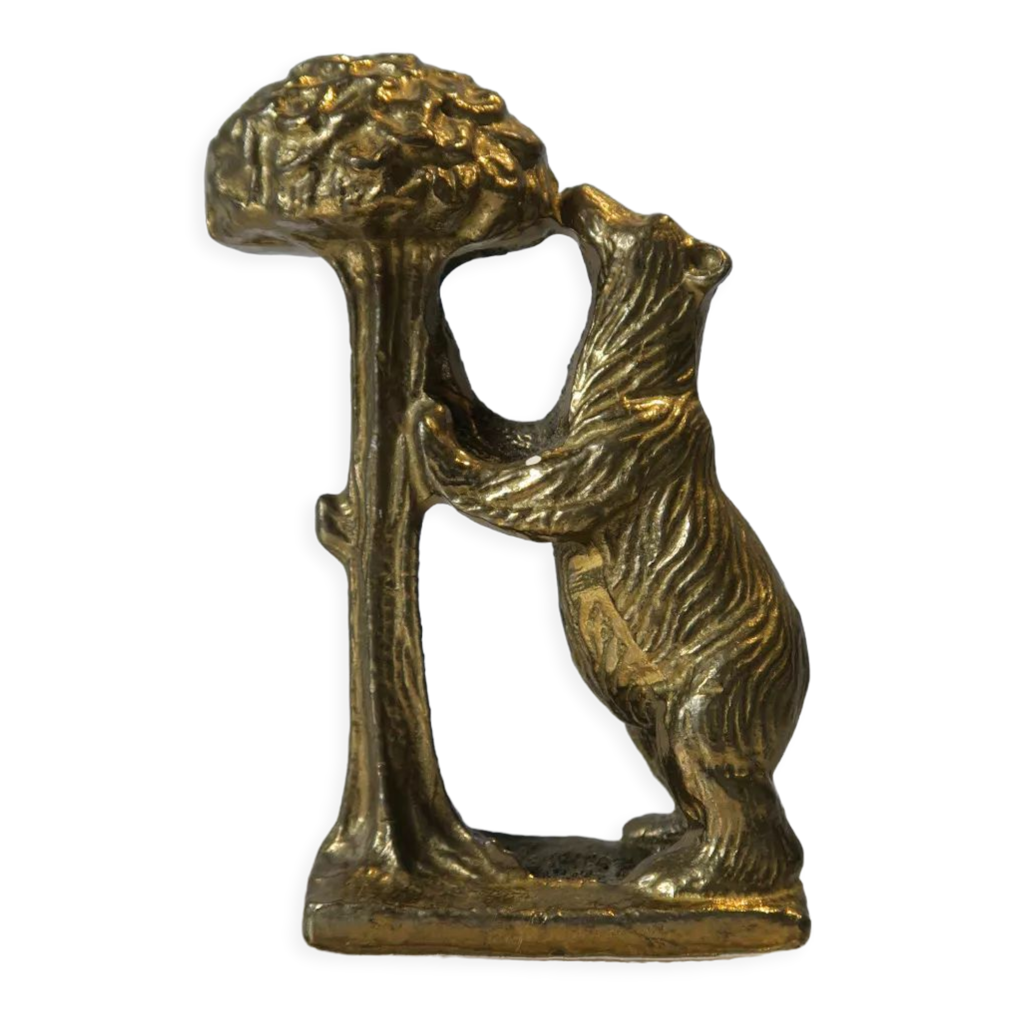Brass sculpture, bear looking for honey in the tree