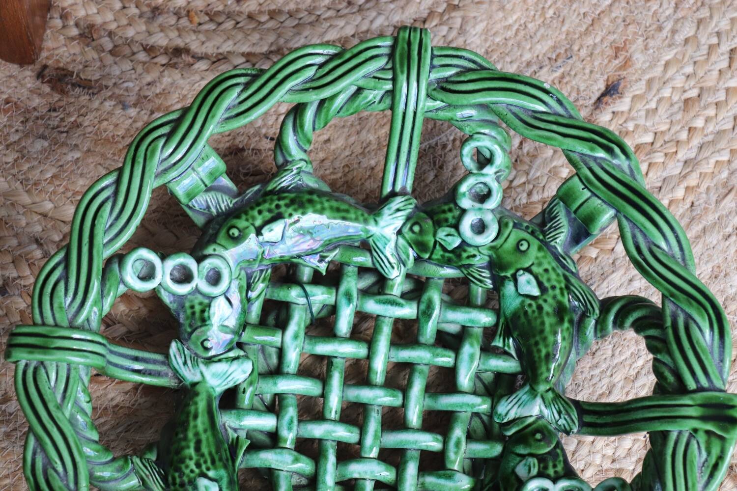 Antique woven basket in green glazed ceramic, fish decoration